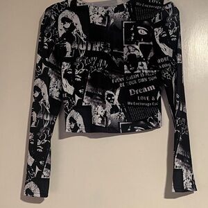 Small black and white reverse newspaper print long sleeve crop top